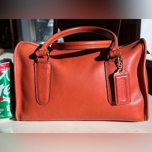 Vintage Coach clutch purse in orange. Good condition